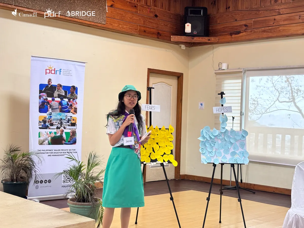 A young woman presents her group’s work during Camp HARAYA.